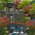 Natural Rockery Stones With Waterfall Red Maple Trees And Pavilion In Traditional Garden