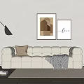 Beige Sectional Sofa with Brown Pillow Plaid Blanket Floor Lamp Geometric Love Lettering Wall Art