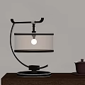 Elegant Modern Table Lamp With Brown Shade Circular Pattern And Black Metal Curved Base 3d model