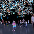 Colorful Bubbles Installation With People Interacting In Dark Background Vibrant Atmosphere