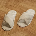 Comfortable Linen Slippers With Cross Strap Design On Light Wooden Floor