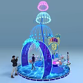Vibrant Jellyfish Shaped Light Installation With People Interacting In Exhibition Area