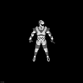 Futuristic Robot In Silver Black Armor With Glowing Accents Standing Against Dark Background
