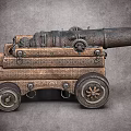 Vintage Metal Cannon With Wooden Carriage Wheels And Cannonballs On Gray Surface