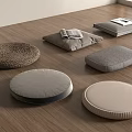 Various Floor Cushions In Round Square Shapes With Woven Fabric On Wooden Floor