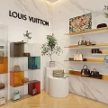 Louis Vuitton Interior Featuring White Marble Walls Colorful Glass Cabinets Golden Shelves Bags Green Plants