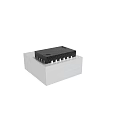 Black Integrated Circuit Chip Mounted On Gray Base With Metal Pins