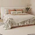 Double Bed with Patterned Bedspread Colorful Pillows Bedside Lamp and Area Rug in Bedroom