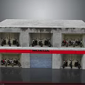 Honda Motorcycles Displayed in Two Story Building With Red Signboard and Windows