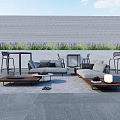 Outdoor Sofa With Coffee Tables Bar Stools In Patio Gray Wall And Purple Plants