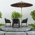 Stylish Outdoor Table With Four Black Rattan Chairs Umbrella And Green Plants On Stone Platform