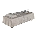 Professional Massage Bed With Light Gray Sheets Towels Tray And Pillow