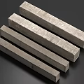 Four Gray Rectangular Concrete Columns With Textured Surface In A Row