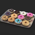 Assorted Donuts With Colorful Frosting And Sprinkles On Metal Tray