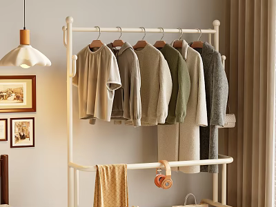 White Metal Clothes Rack with Hanging Casual T-shirts Sweaters in Cozy Home Interior Setup 3d model
