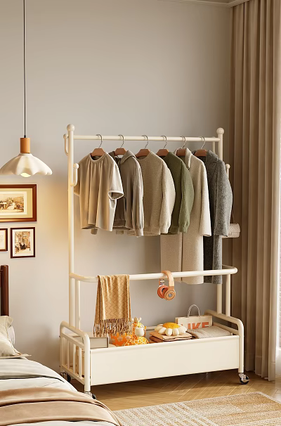 White Metal Clothes Rack with Hanging Casual T-shirts Sweaters in Cozy Home Interior Setup 3d model