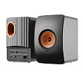 High Quality Black Speakers With Orange Drivers On Sturdy Stands For Home Audio