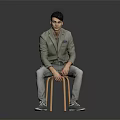 Man Sitting on Wooden Stool Wearing Light Green Blazer Gray Pants and Gray Shoes