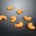 Golden Brown Whole Cashew Nuts on Dark Shiny Surface with Natural Texture
