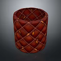 Red Cylindrical Storage Bin With Quilted Diamond Pattern And Orange Accents