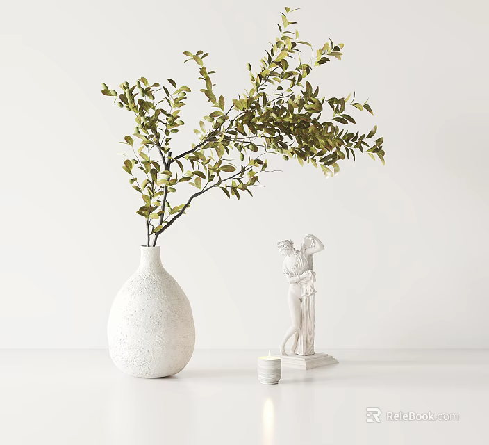 White Vase With Green Foliage Next To White Statue And Small Candle On White Table 3d model 