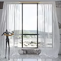 White Sheer Curtains Framing Large Window with Black Sculpture Holding Golden Rings and Mountain View