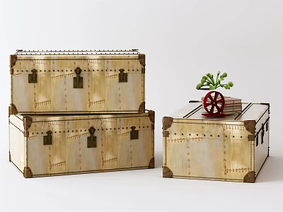 Vintage Metal Trunks With Riveted Details And Small Potted Plant Accent 3d model