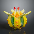 Colorful Sea Creature With Yellow Body Green Stripes And Red Spots