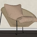 Modern Curved Rattan Leisure Chair With Beige Cushion And Black Metal Legs