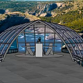 Scenic Glass Arch Viewing Platform With Tiled Floor Overlooking Coastal Water And Hills