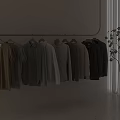 Hanging Casual Shirts And T-Shirts With Neutral Tones On Minimalist White Wall