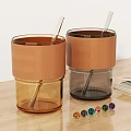 Dark Coffee Cup With Brown Leather Sleeve Foamy Coffee And Glass Straw On Wooden Table