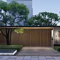 Modern Entrance Gate With Wooden Slats Surrounded By Trees And Lawn