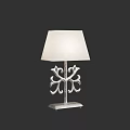 Elegant Table Lamp With White Fabric Shade And Intricate Metal Base Design