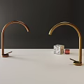 Brass and Gold Faucets on White Countertop with Dark Gray Yellow Wall and Marble Cube