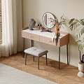 Pink Dressing Table With Round Mirror Stool Cosmetics And Potted Plant On Wooden Floor