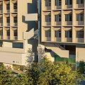Modern Multi Storey School Building With Large Windows Balconies And Green Lawn Area