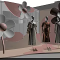 Fashion Window Display With Mannequins In Dresses And Large Pink Flower Decorations