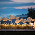 Illuminated Outdoor Lights In Rice Field With Fish Shaped Structures And Wooden Pathway At Dusk