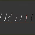 Various Types Of Weapons Displayed On Orange Stands With Different Shapes And Reflective Bases