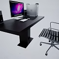 Black Office Desk With Computer Monitor CPU Tower Speakers Keyboard Mouse And Ergonomic Chair