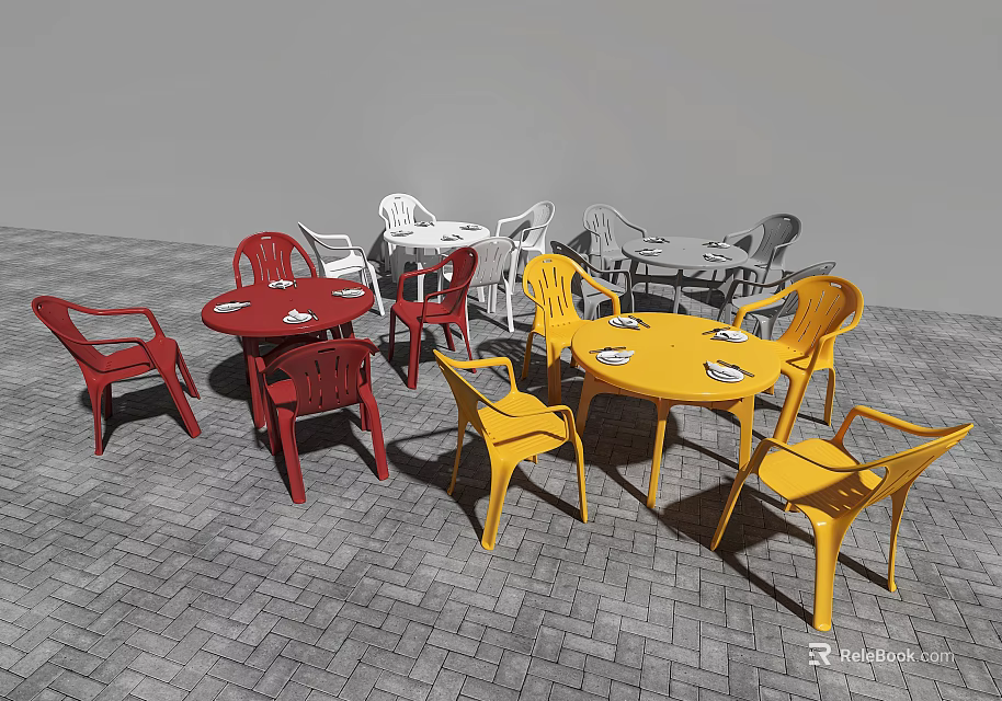 Outdoor Table Set With Red Yellow White Chairs On Brick Pavement 3d model