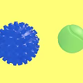 Blue Spiky Decorative Ball And Green Tennis Like Ball On White Background