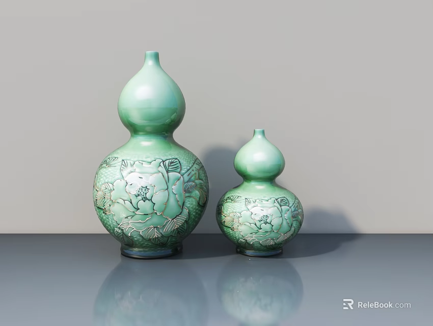Two Green Gourd Shaped Ceramic Sculptures With Intricate Carved Patterns On Table 3d model 