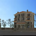 Elegant Three Story Detached Villa With Tile Roof Trees Greenery And Outdoor Seating