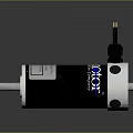 Black And Silver Cylindrical Electric Motor With Metal End Caps And Rotating Shafts