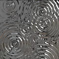 Modern Metallic Wall Decor With Concentric Circle Patterns And Reflective Ripple Effect