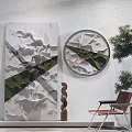 Modern Wall Decor with 3D Textured Panels Circular Artwork Green Accents and Potted Plant