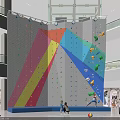 Colorful Indoor Climbing Wall In Shopping Mall With Climbing Holds And People