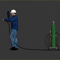 Worker in Blue Uniform and Safety Helmet Using Welding Machine with Green Gas Cylinder